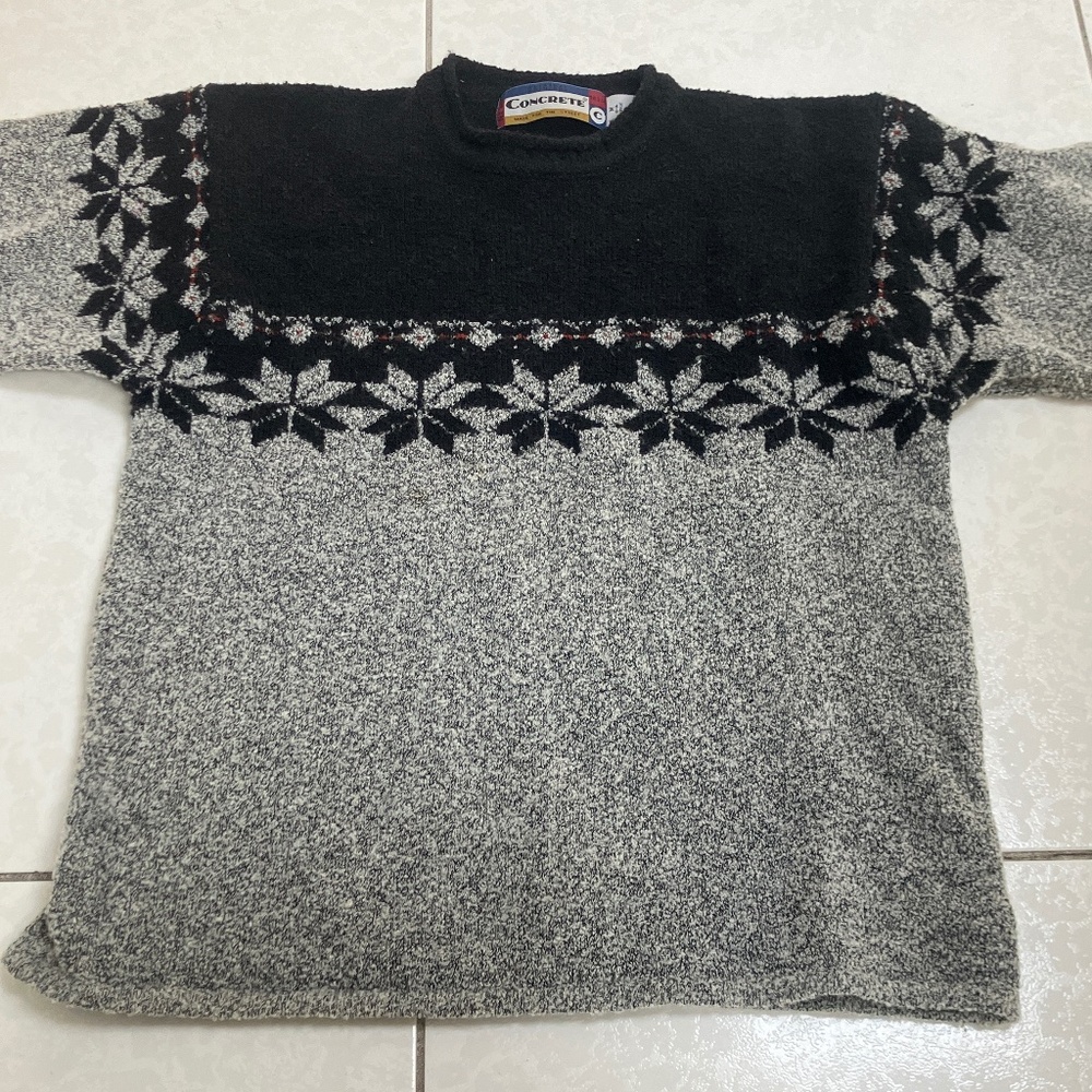 Girls sweater with argyle pattern.